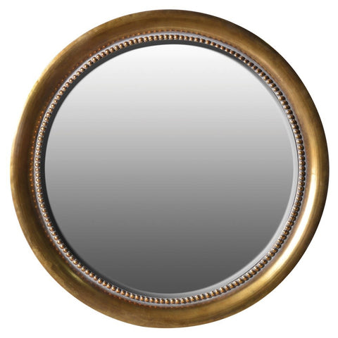 A Round Gold Wall Mirror With A Studded Finish